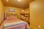 Lower bedroom with queen bed and built in single bunks